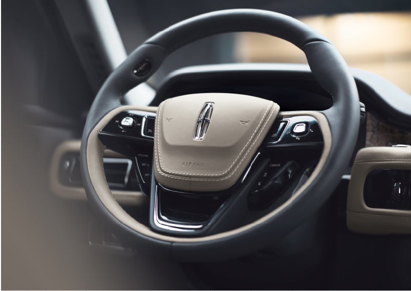 The intuitively placed controls of the steering wheel on a 2023 Lincoln Aviator® SUV | Astro Lincoln in Pensacola FL
